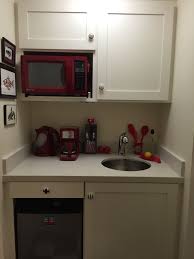 In some motel and hotel rooms, small apartments, college dormitories, or office buildings, a kitchenette consists of a small refrigerator, a microwave oven, and sometimes a sink. Kitchen In A Closet In A Bedroom Suite Used As A Studio Small Kitchen Storage Kitchen Design Small Tiny Kitchen