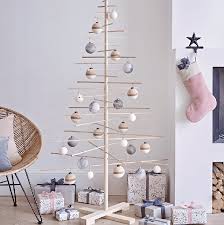 I love browsing through photos to see how other people have decorated them. 15 Wooden Christmas Trees To Buy This Festive Season