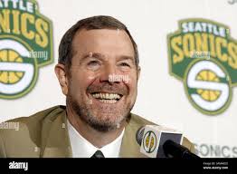 Seattle SuperSonic's new head coach P.J. Carlesimo, left, heads to be  interviewed by the media after he was introduced at the NBA basketball  team's Furtado training facility in Seattle,