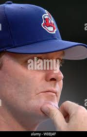 Cleveland Indians manager Eric Wedge, center, talks with catcher Kelly  Shoppach, left, and relief pitcher Greg Aquino as shortstop Asdrubal  Cabrera watches, right, during a baseball game against the New York Yankees