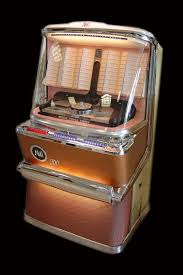 Ami model h jukebox from 1957 jukebox arcade bar radios radio antigua vintage music vintage box music machine rock and roll juke box ami i 200 ami i 200 1958 near a général electric fridge from 40's; Classic Rock Ola Ami Jukeboxes For Sale Jukebox Co