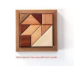 This wooden puzzle takes about an hour to build, and it's way easier to build than it is to solve! Wood Puzzle Brain Teaser 10 Piece Geometric Jigsaw Etsy Wood Puzzles Diy Wood Puzzles Jigsaw Projects
