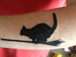Black Cat On Broomstick Black Cat Tattoos Cat Tattoo Maple Leaf Tattoo