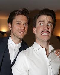 Aaron opening Moulin Rouge's 2021 Tony Awards performance by standing in  the rain