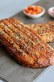 Barbari Is A Traditional Iranian Flatbread Its Shiny Crust Is Due To The Romal A Mixture Of Baking Soda And Flour Iranian Recipes Iranian Desserts Iran Food
