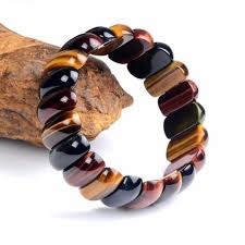 Associated with yellow stones, like tiger's eye crystal, the solar plexus chakra, or manipura chakra, can facilitate your ability to trust yourself and pave your own way in life. Rectangular Red Blue Yellow Tiger S Eye Bracelet So Good Vibes