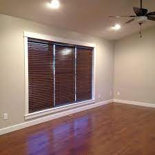 Living Room With Sherwin Williams Agreeable Gray Walls And Solid Wood Blinds Curtains With Blinds House Blinds Living Room Blinds