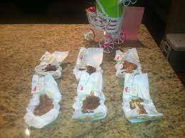 Guess What S In The Smelly Diaper Baby Shower Game Melted Candy Bars Look Gross But Lots Of Fun Baby Shower Diapers Baby Shower Fun Moon Baby Shower