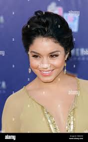 In this July 19, 2011 photo, attached by rope to a waiting helicopter,  researcher Carl Gladish walks back after deploying a GPS seismometer, or  GeoPebble, to track glacial movement