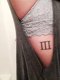 By combining a roman numeral tattoo with the arrow symbol you can cross off two major body art trends in one fell swoop. Third Sibling Of The Family Roman Numeral Three Tattoo Tattoos Trendy Tattoos Shoulder Tattoos For Women