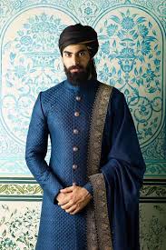 Sabyasachi 2018 Collection For Brides Grooms Decoded Here Indian Groom In Blue Sherwani And Turban Etsy Wedding Dress Sherwani Groom Groom Wedding Dress