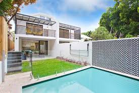 The pool deck should match or complement the colors and materials found on the home's exterior Bondi Subtle Duplex With Hidden Attic Fits In With Traditional Streetscape With A Modern Interpretation Edifice Design Architects Sydney Eastern Suburbs Maroubra