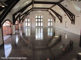 Garages Do Not Get Much Larger Than This Contemporary Beauty With The Black Concrete Flooring That Has Been Garage Floor Garage Floor Coatings Barn Style Doors