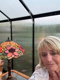 Relaxing in the greenhouse with flowers