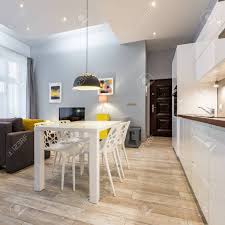 open kitchen with white dining table