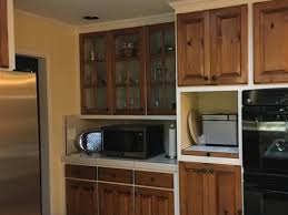 I painted only the door and drawer fronts on the bottom cabinets and left the top cabinets as they were. Before And After Kitchen Cabinet Paint