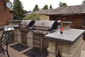 Grilling Station And Outdoor Kitchen Area With Backsplash And Natural Stone Countertops Outdoor Kitchen Countertops Outdoor Kitchen Outdoor Kitchen Design