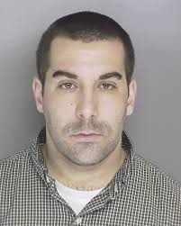 Warrant issued in connection with stolen checks in Cumberland County