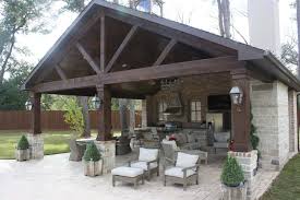 Empty wooden deck table with tablecloth. Creekstone Outdoor Living Rustic Cabana With Full Outdoor Kitchen Living Space 1 Creekstone Outdoor Living