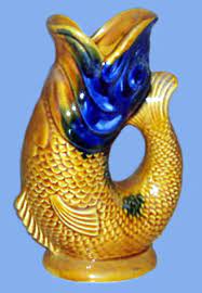 One has a couple of small grazes to the fins but otherwise good condition. Gurgle Or Glug Fish Jugs Torquay Pottery Collectors Society