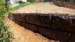 Here are a few more shots of the completed retaining wall. Acid Stained Big Block Concrete Retaining Wall Youtube
