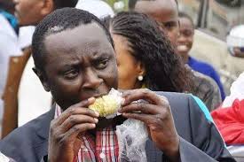 Image result for raila odinga eating roasted maize