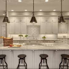 The counter area with the cooking range goes even further by combining white kitchen cabinets with black overhead cabinets, black granite countertop and white tile backsplash. 75 Beautiful Granite Countertop With White Cabinet Pictures Ideas Houzz