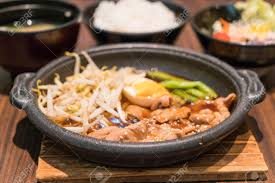 I'm going to be in seoul and surrounding areas this week, and would find a korean bbq restaurant that serves side dishes like noodles or bibimbap too. Korean Spicy Bbq Pork Served On A Hot Plate With Side Dishes And Rice Stock Photo Picture And Royalty Free Image Image 61180038