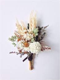 Buy these while they last at the store, because they'll last forever at home. Boutonnieres For The Stylish Groom That Last Forever Dried Flower Bouquet Flowers Bouquet Dried Flowers