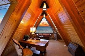 This attic office idea by xer0 group makes the most out of an expansive space by incorporating traditional english roll arm chairs and a television —perfect for relaxation or me time at the end of the work day (don't tell the kids). Inspirational Attic Home Office Designs Decor Report