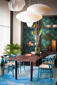 Experience endless summer with these leafy modern interiors and breezy design products. 44 Island Inspired Interiors Creating A Tropical Oasis Tropical Home Decor Dining Room Decor Tropical Interior
