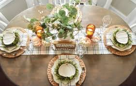 At each place, a kraft paper list allows each guest to write down what they're thankful for. Thanksgiving Table With Blue And Amber Accents The Frugal Homemaker