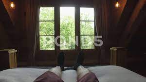pov looking at my feet at end of bed in ... | Stock Video | Pond5