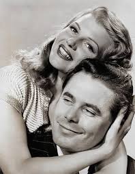 David Oliver, Hope Hampton, and Glenda Farrell in a publicity photo for  "The Road to Reno" (1938).