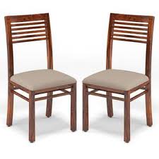 Thanks to the thickly padded seat and backrest, these artificial leather chairs are very comfortable to sit on. Zella Dining Chairs Set Of 2 Urban Ladder
