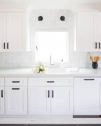 We Love The Modern Elegance Of This Minimal And Bright Kitchen Our Frameless Shaker Style Classic White Kitchen Custom Kitchen Cabinets Shaker Style Cabinets
