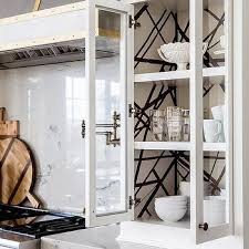 wallpaper on back of cabinet design ideas