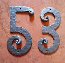 A wrought iron frame that holds six mission tile numbers or five number tiles and two endings. Hand Forged Wrought Iron House Numbers From 0 9 Height 8 4 Handmade Housenumber Homedecor House Numbers Wrought Iron Numbers Metal Projects