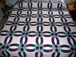 The Rings Of Our Double Wedding Ring Quilts Are Made Entirely Of Batik Print Fabrics In Rich Shades Of Blue Double Wedding Ring Quilt Wedding Ring Quilt Quilts