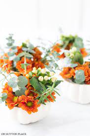 Mini Pumpkin Flower Arrangements On Sutton Place Here is a super easy and inexpensive way to dress up your porch for fall. mini pumpkin flower arrangements on