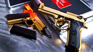 What is a desktop wallpaper? Pistols Guns Wallpaper Gold Guns Images Hd 1920x1080 Download Hd Wallpaper Wallpapertip