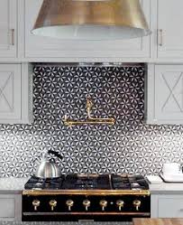 Black And Gold Range In The Kitchen Mosaic Tile Backsplash Home Decor And Interior Decorating Ideas White Kitchen Cabinets Interior House Interior Home