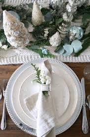 27 gorgeous & easy christmas table decorations, settings & best diy centerpiece ideas using runners, candles, pine cones, mason jars, & more! Soft And Wintery Christmas Table With Touches Of French Blue