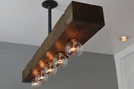 It's form factor, typically linear, works well in open ceiling with exposed beams. Recessed Wood Beam Chandelier West Ninth Vintage
