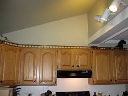 Currently have a 12 soffit and cabinets on each side. Height Of Uppers In Small Kitchen With Vaulted Ceiling Opinions