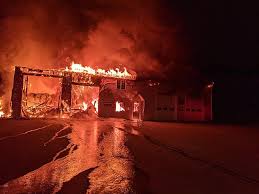 Several fire departments, the maine forest service and a helicopter have been called to battle a wildfire that broke out on frost. Fire Levels Bouchard S Garage In Hampden