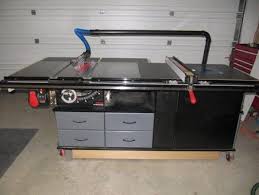 My Sawstop And Router Cabinet With Fold Down Outfeed Table And Dust Arm Woodworking Shop Storage Ideas Woodworking Table Table Saw Workbench