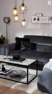 leuchten mit filigranen metallstreben in schwarz fugen sich nahtlos in den monochrom in 2021 living room decor apartment black sofa living room small living room decor