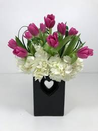 Order your flowers at the florist who is known for the top quality and flower ordering and delivery. Romantic Tulips The Name Speaks For Itself A Wonderful Ceramic Vase Available In 3 Colors Black Red A Tulips In Vase Same Day Flower Delivery City Flowers