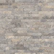 This outdoor hardscape installation features travertine pavers, a veneer and pebble waterfall and fire feature ideas. Msi Stone Silver Travertine Silver Travertine 8x18 Tumbled Veneer Natural Stone Dallas Texas Cc Carpet